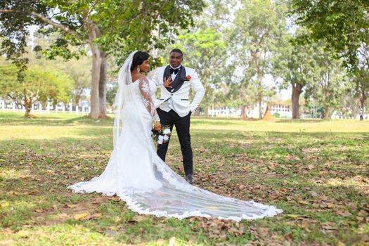 Bride and Groom Doing a Prenup Shoot in the Grass Field