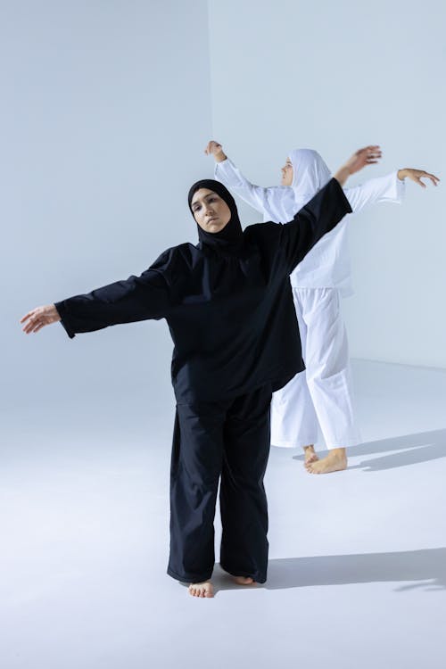 Woman in Black Hijab Dancing