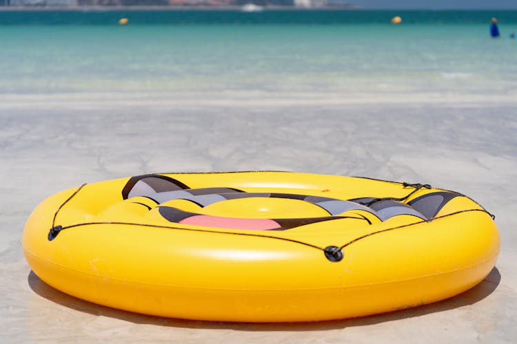 Yellow Inflatable Ring On Beach