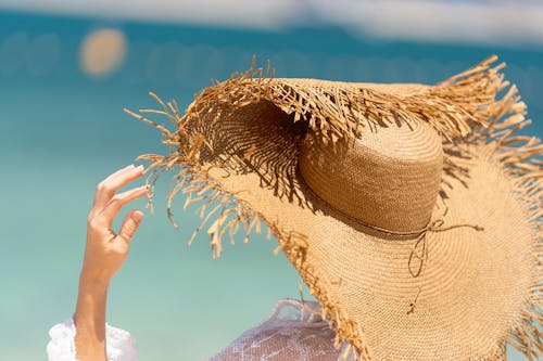 Close-Up Shot of a Person Wearing a Sun Hat