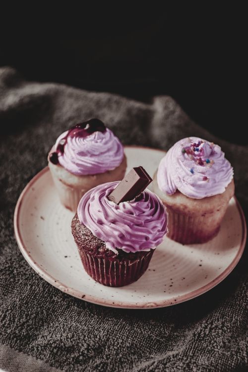 Free High angle of delicious sweet cupcakes decorated with cream and chocolate with berry Stock Photo