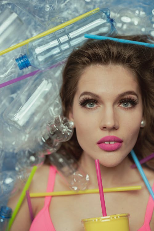 Woman With Pink Lipstick Holding a Plastic Cup