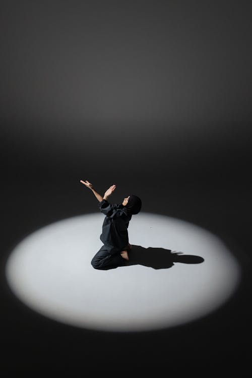 Woman in Black Clothing Dancing