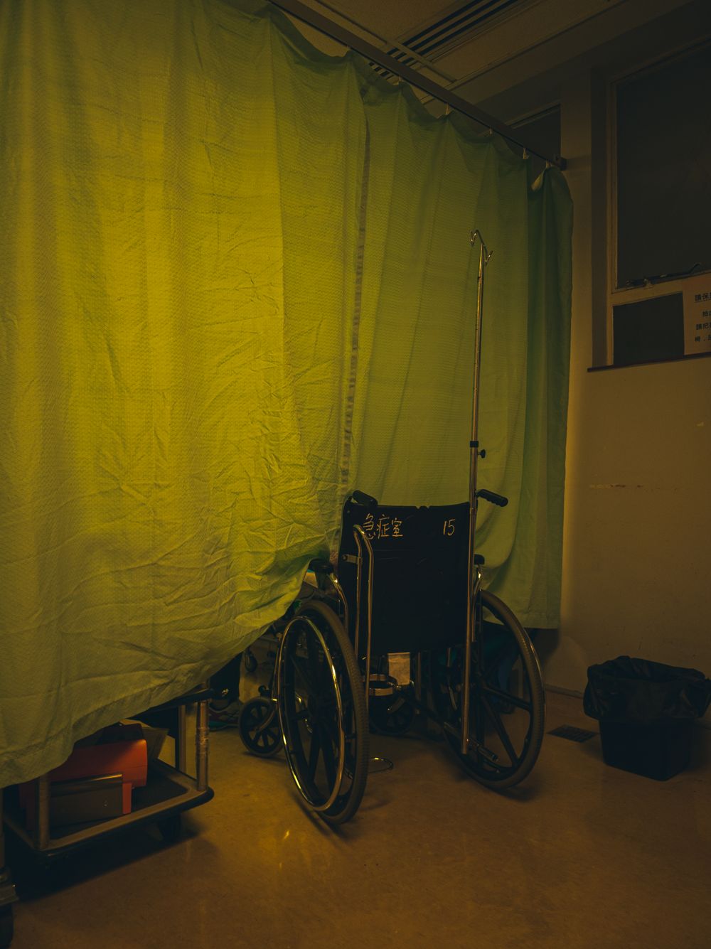 Wheelchair in a hospital room representing serious injury recovery