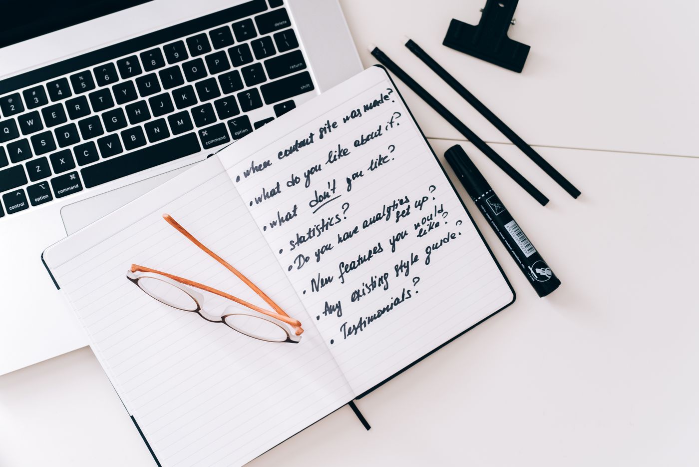 Laptop and notebook representing business planning and marketing strategy