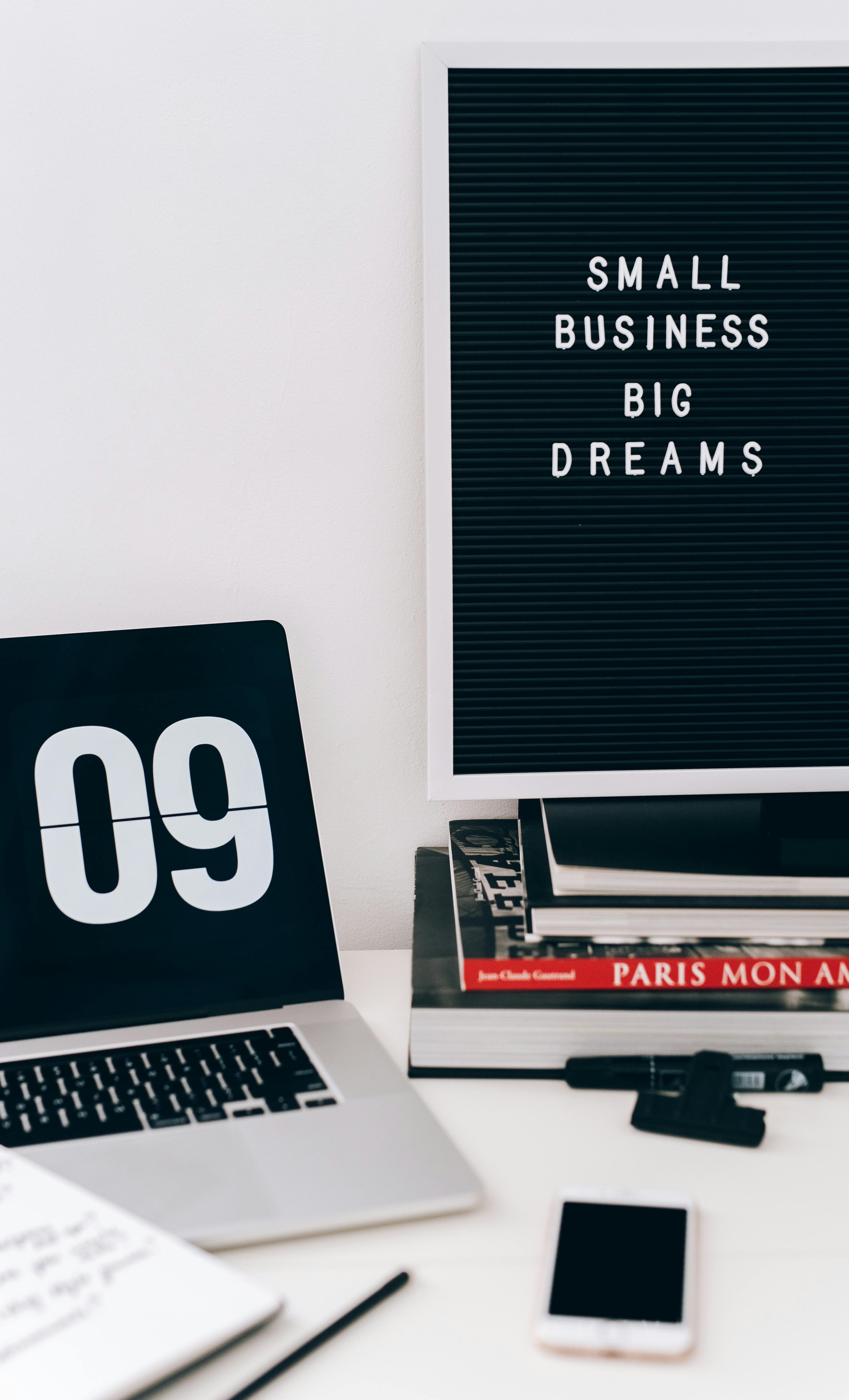 Black and silver laptop on white table free stock photo