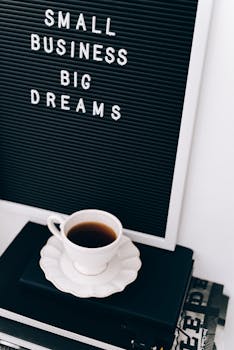 Motivational letter board with coffee cup, ideal for entrepreneurs.