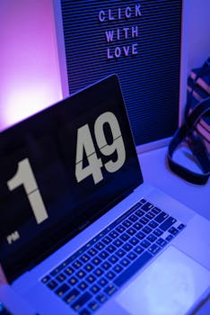 A cozy and modern workspace featuring a laptop and inspirational message board.