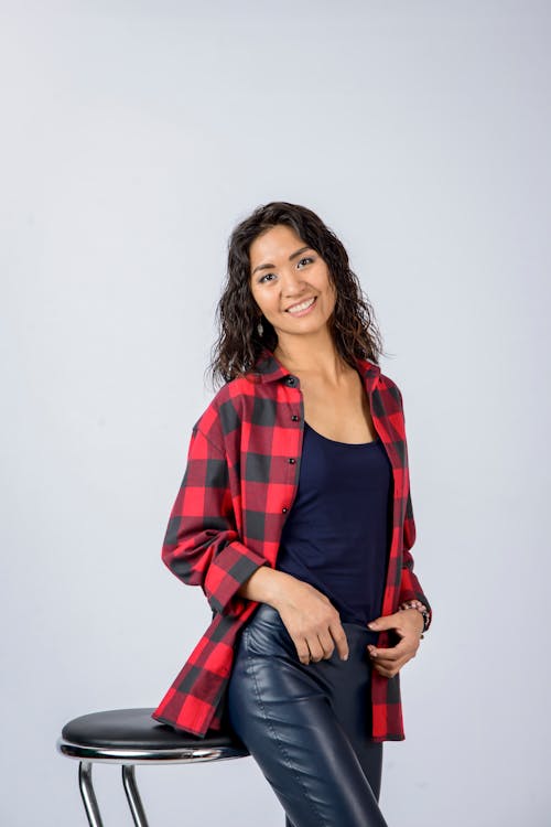 Woman in Red Plaid Shirt Smiling at Camera