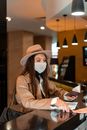 A Woman Inquiring for Her Hotel Accommodation