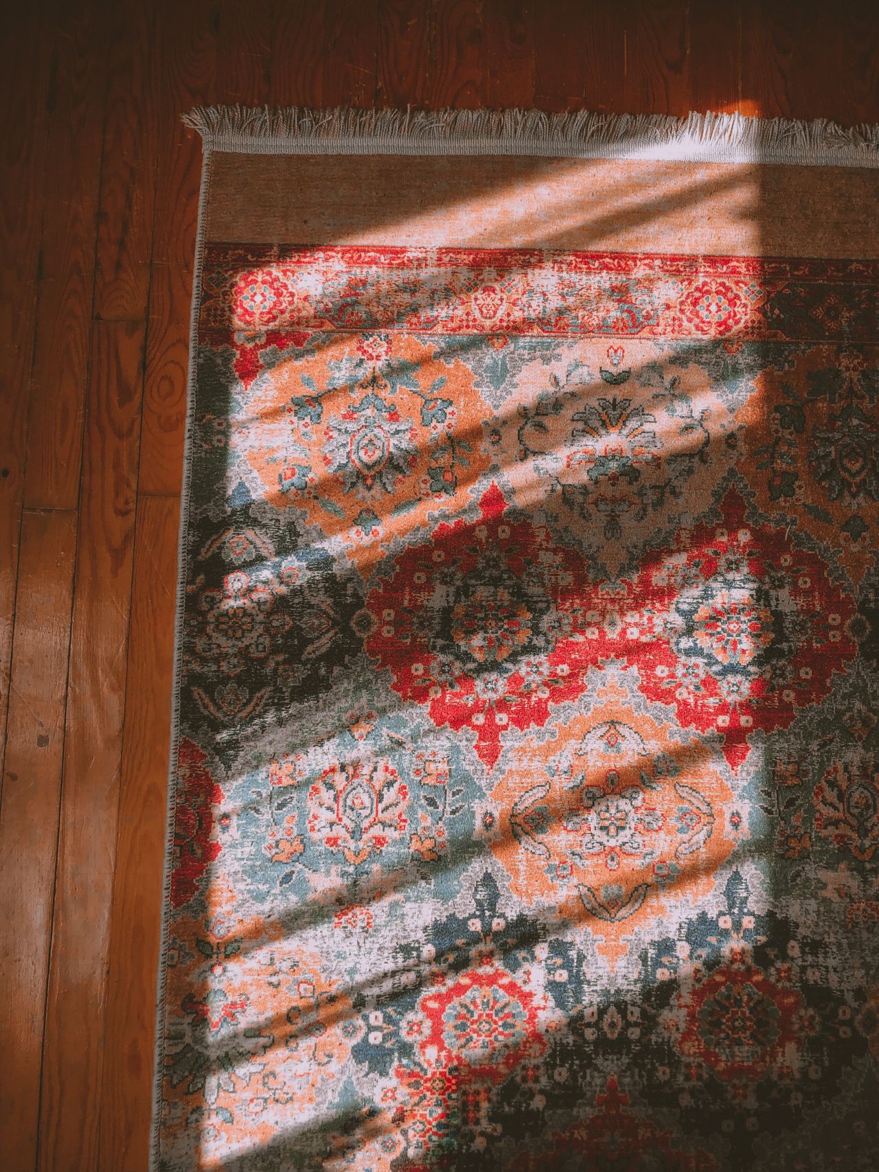 layered-rugs-boho-bedroom Layered rugs on a bedroom floor