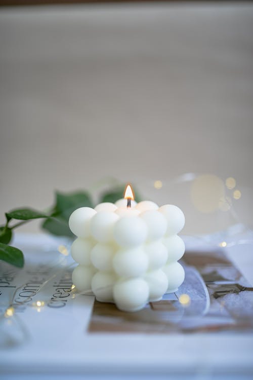 White Lighted Candle on the Table
