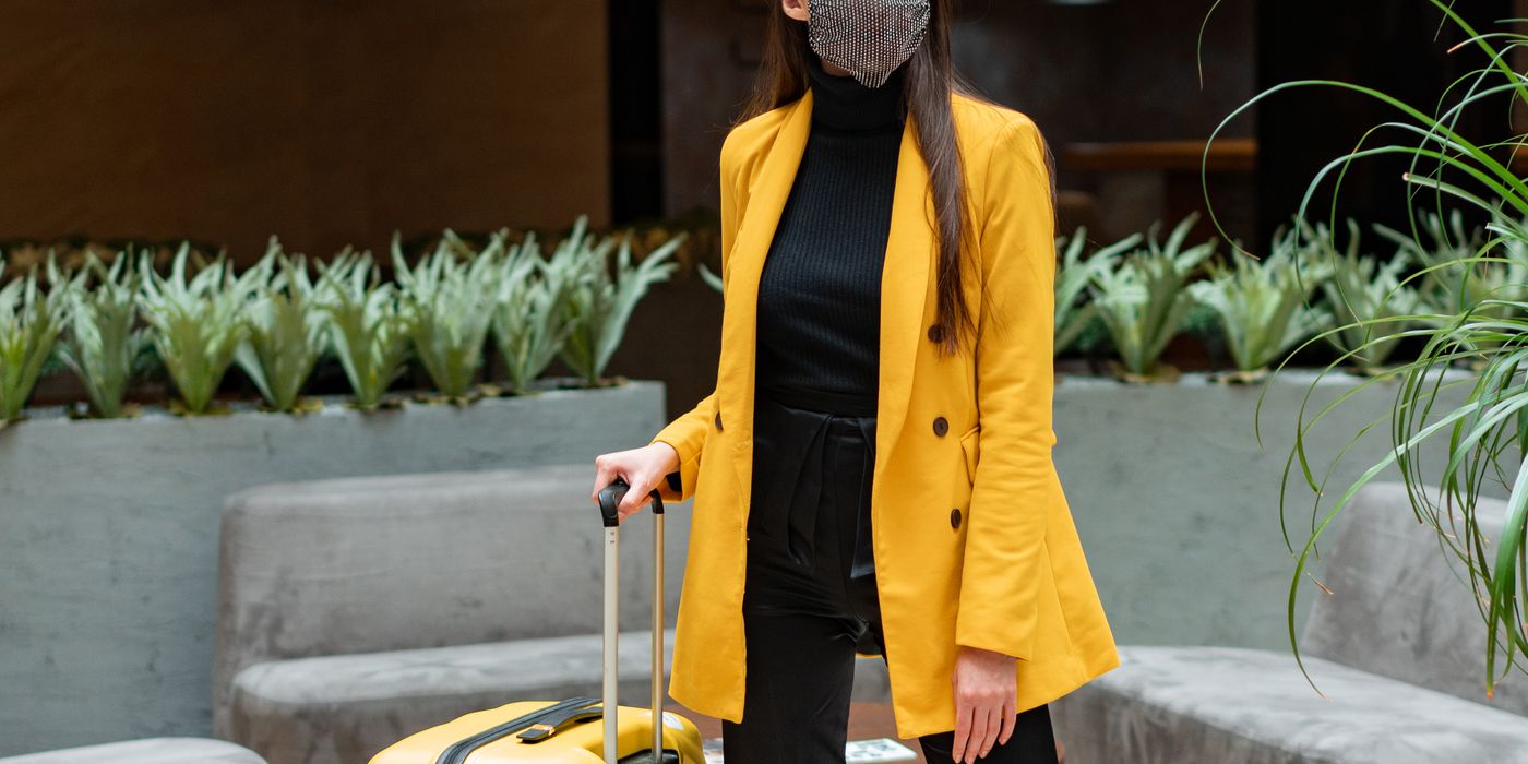Hotel guest at a check-in desk representing a hotel loyalty program stay