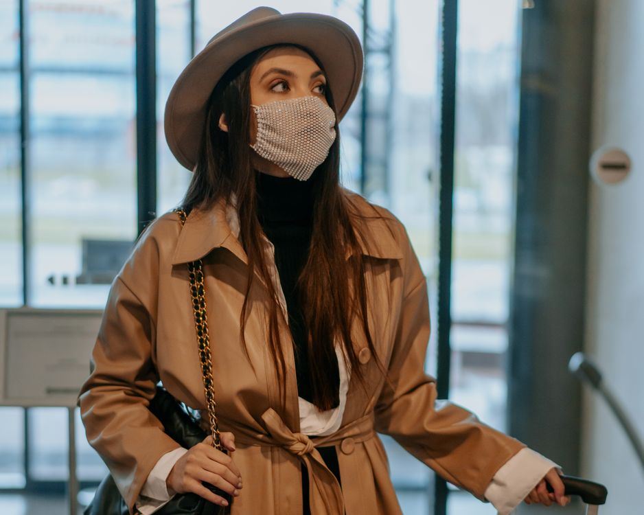 A Woman in Brown Coat Wearing Brown Hat · Free Stock Photo