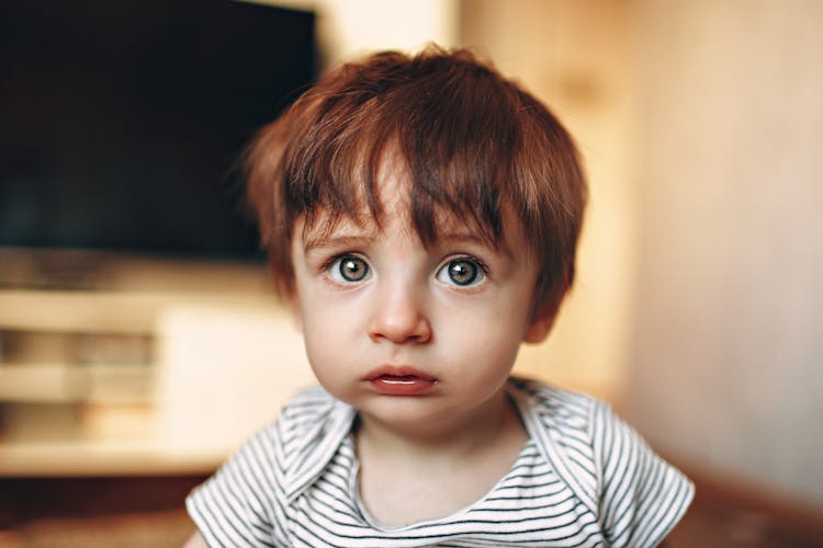 Upset Child In Living Room