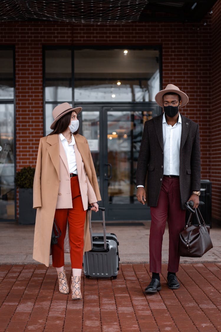 Photo Of A Fashionable Couple Walking Together