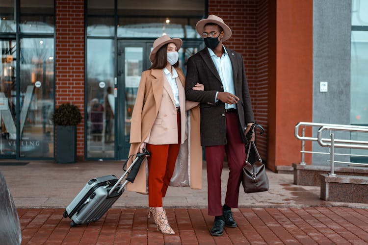 Couple Standing Outside Of The Hotel