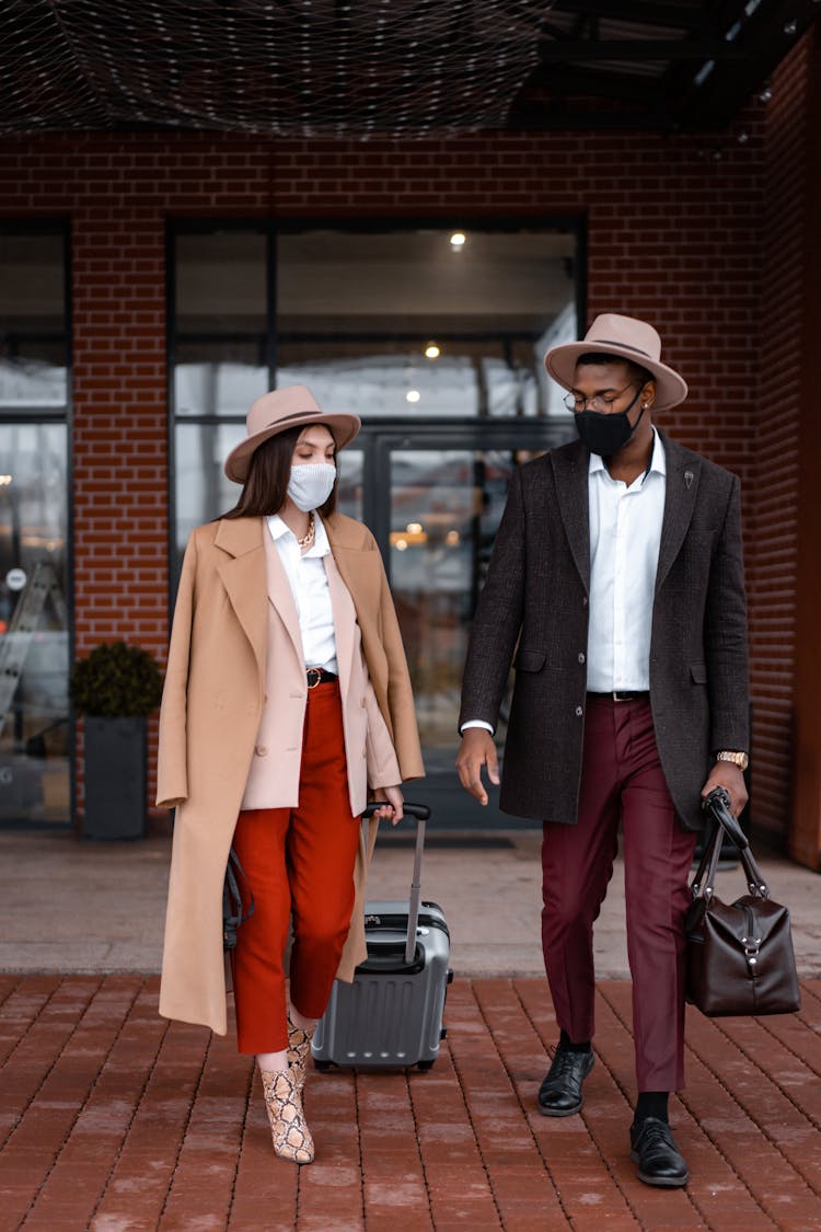 Couple Walking Outside Of The Hotel