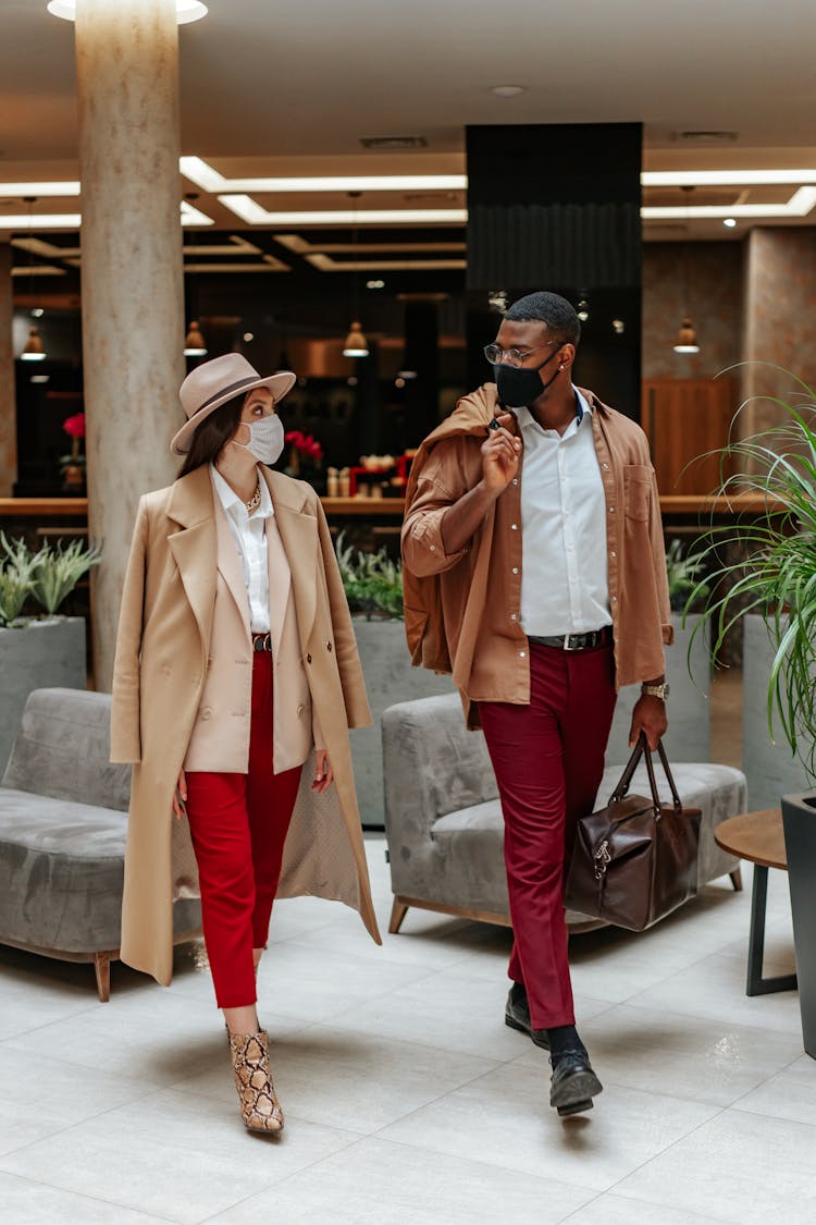 Couple Walking Inside Of The Hotel