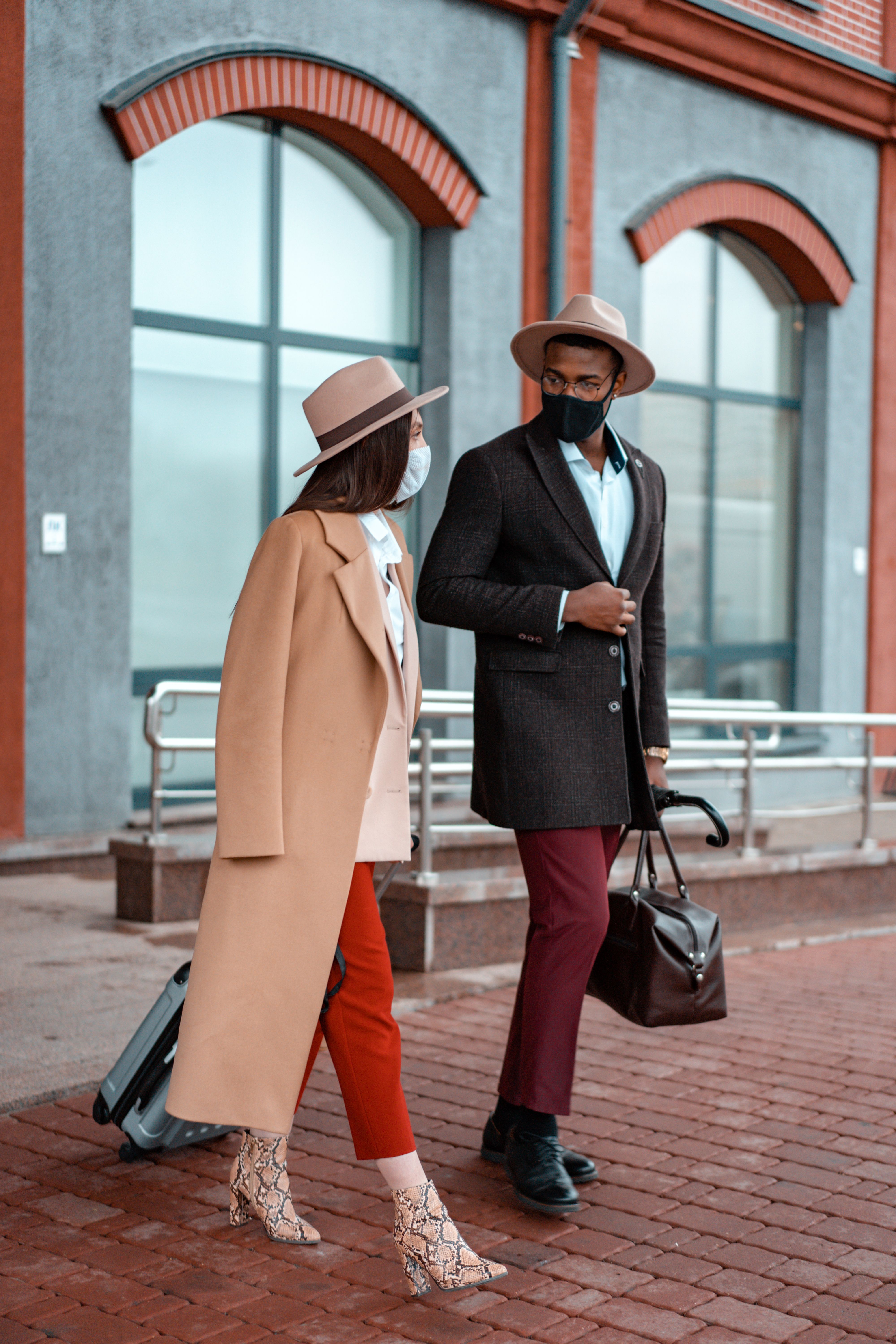 Couple Walking on a Pavement · Free Stock Photo
