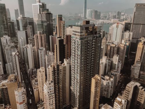Free Aerial view of modern city with high rise buildings and skyscrapers in daytime Stock Photo