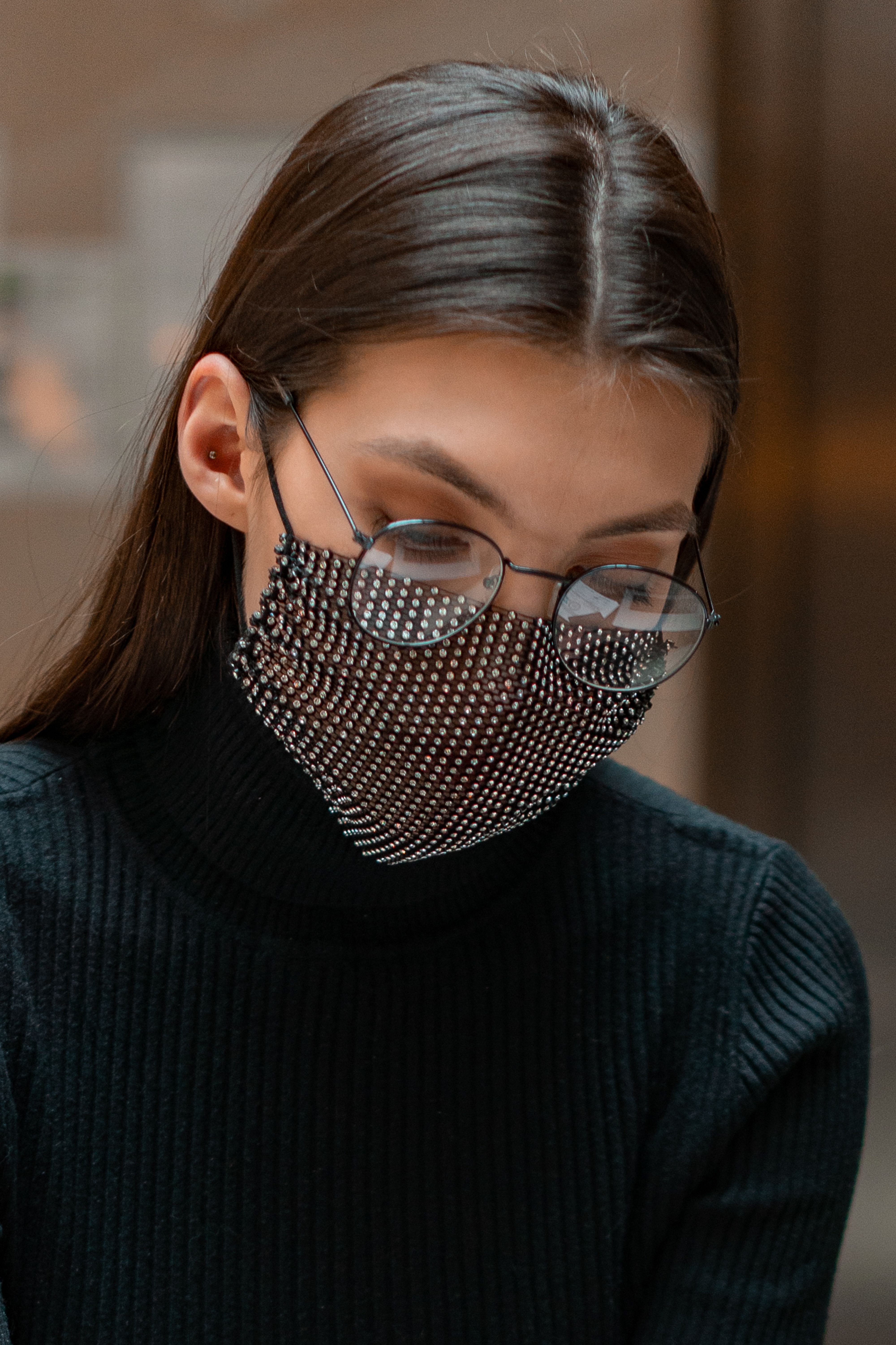 Portrait of a Woman in a Black Top Wearing a Face Mask · Free Stock Photo