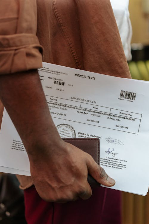 Free Close-up of Man Holding Documents  Stock Photo