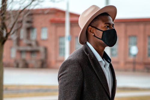 Photo of a Man Wearing Brown Hat