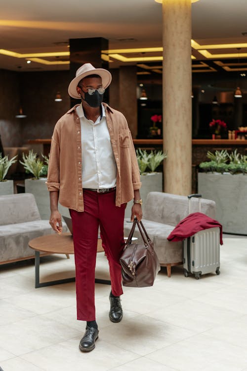 Stylish Man Holding a Brown Bag