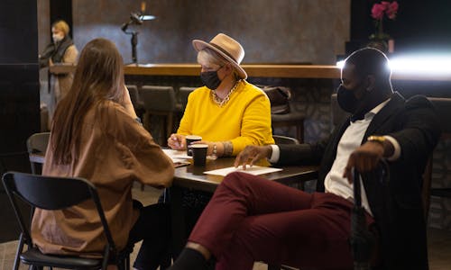 Free People Wearing Face Masks at a Restaurant Stock Photo