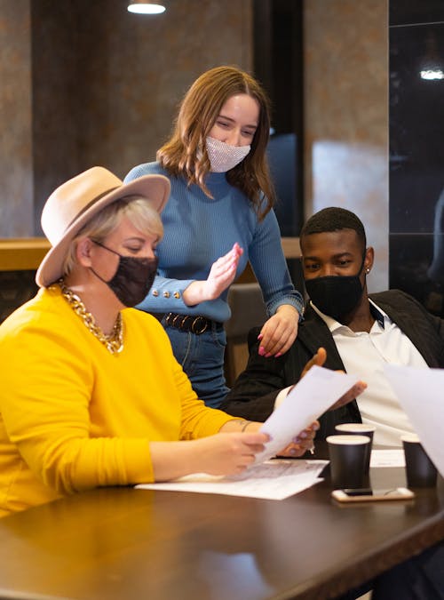 People Wearing Face Masks Having a Conversation