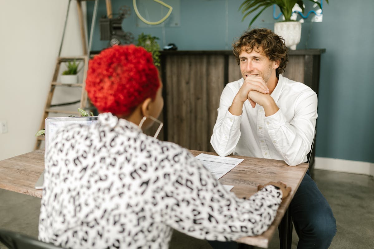 Professional team meeting discussing employee support and planning