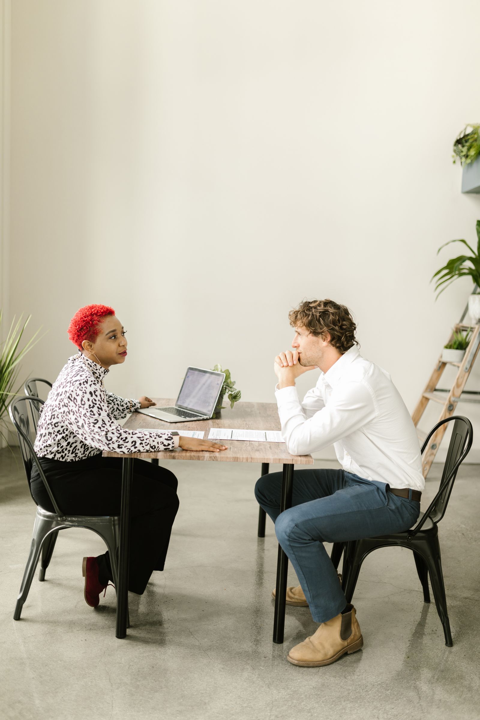 Sellers planning their listing strategy with a real estate agent at a table