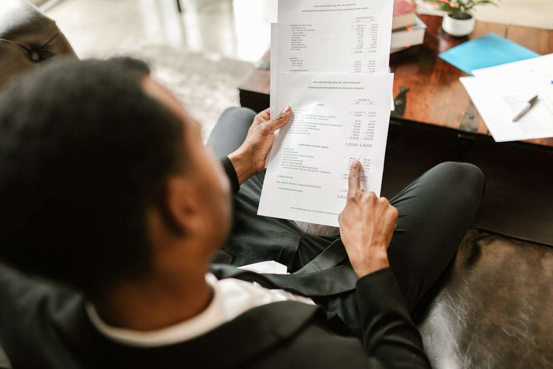 Free Man pointing on Documents Stock Photo