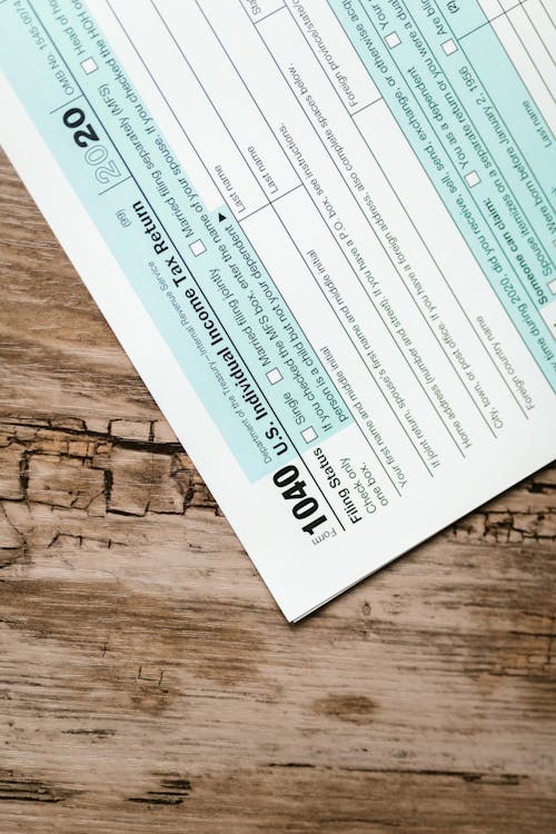 Tax Form On Wooden Surface