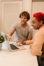 Man in Gray Crew Neck T-shirt Using Macbook Pro