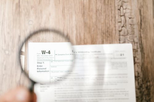 Free Close-Up Shot of a Document through a Magnifying Glass  Stock Photo