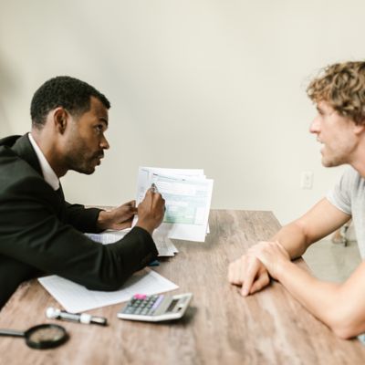 Consultant showing documents to a client