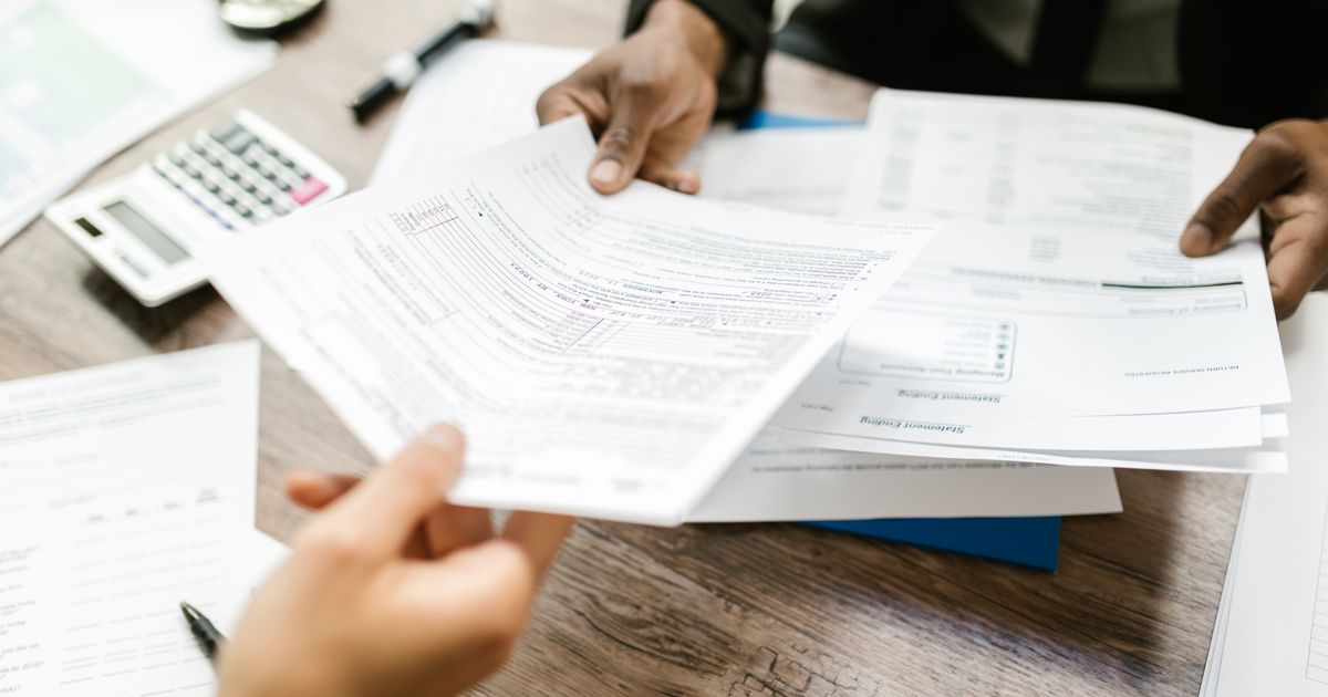 Practice manager and revenue cycle partner reviewing monthly billing performance reports Practice manager and revenue cycle partner reviewing monthly billing performance reports