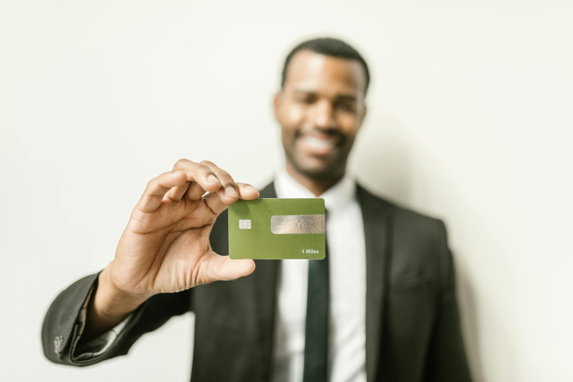 A Man Holding a Card