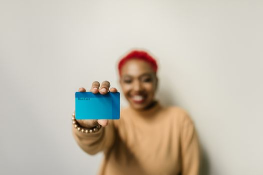 A Woman Holding a Blue Card