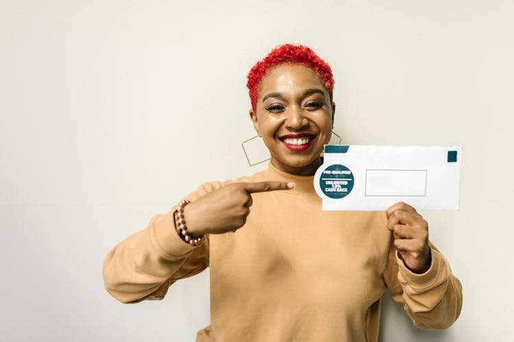 A Woman Holding An Envelope