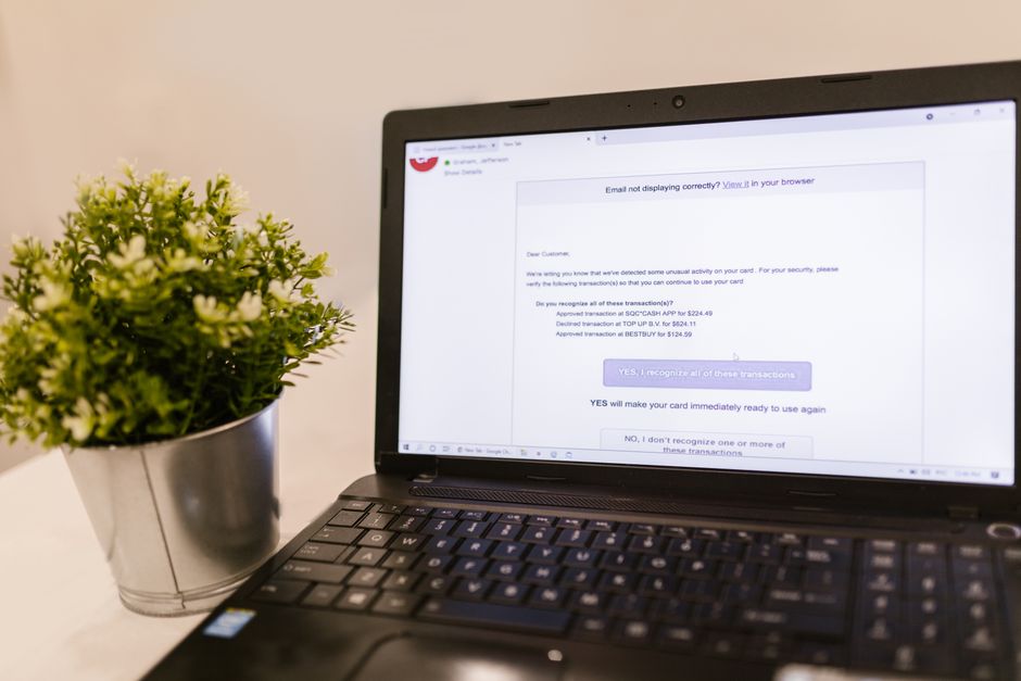 Laptop displaying email inbox with marketing notifications