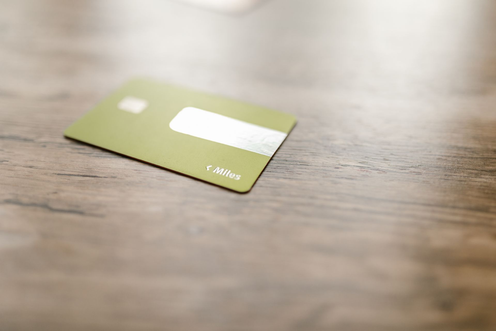 Green Card on Brown Wooden Surface