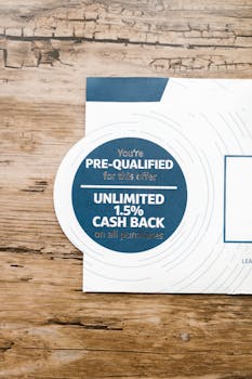 Close-up of a pre-qualified offer with cashback deal on a rustic wooden surface.