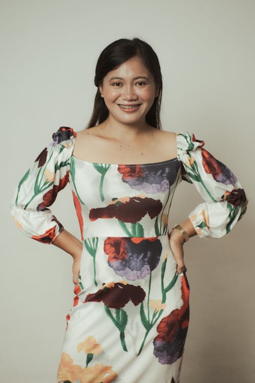 A Woman Modeling in a Floral Dress