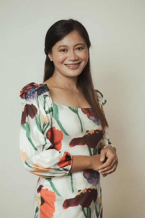 Pretty Woman in Floral Dress Smiling