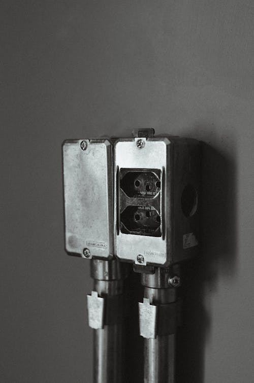 Free Monochrome Photo of a Wall-Mounted Plug Socket Stock Photo