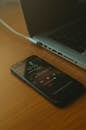 Black Smartphone on Wooden Table