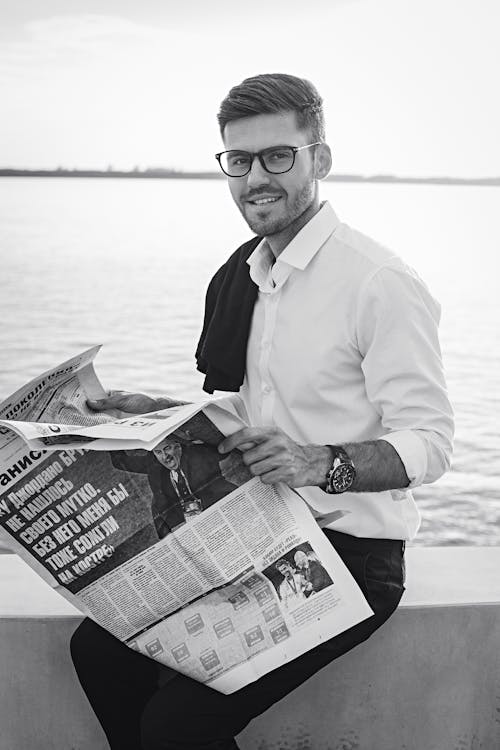 A Man Holding a Newspaper 